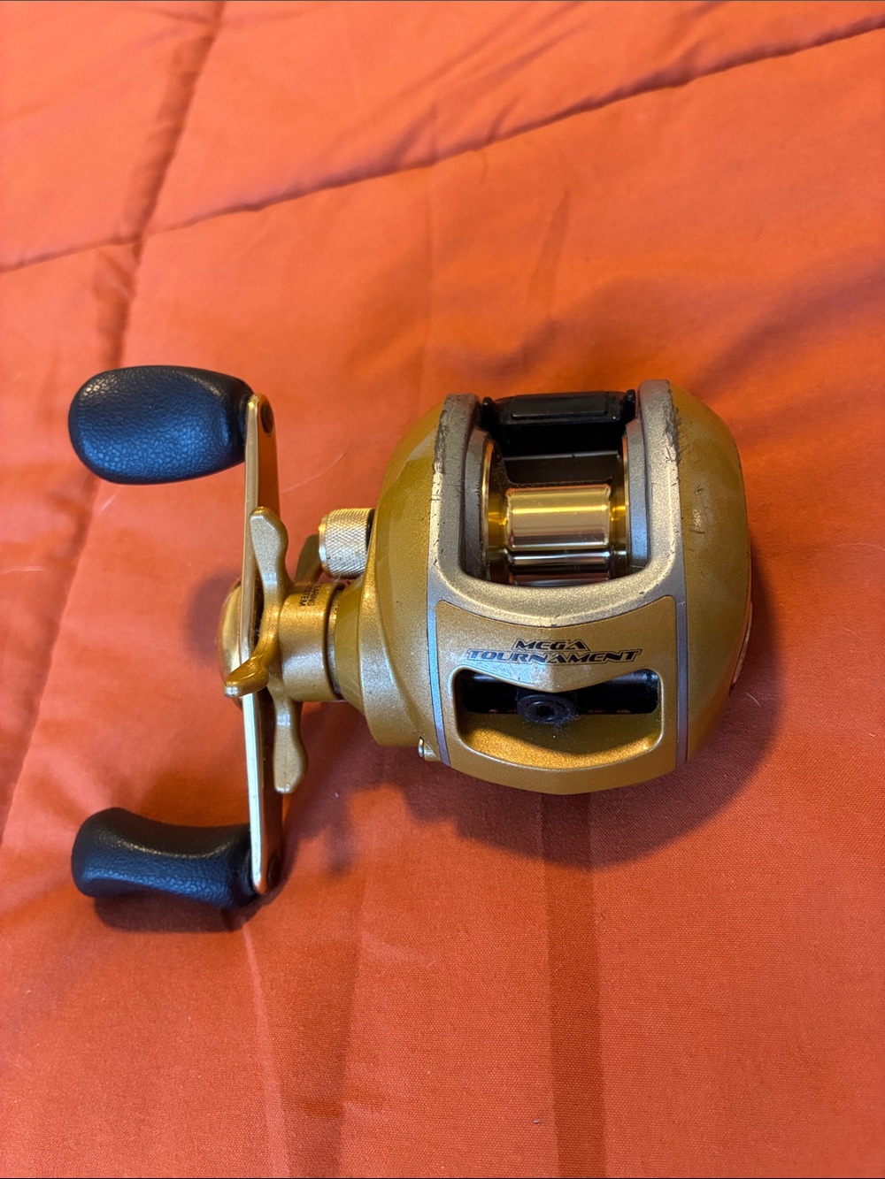 Bass Pro Shops Gold and Black Baitcasting Reel